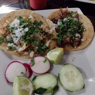 Pollo Taco on the left. Carnitas Taco on the right.