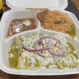 Chicken enchiladas with green sauce, beans and rice.