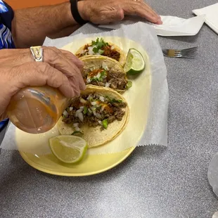 two tacos on a yellow plate