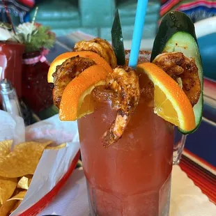 a mexican drink with a garnish garnish