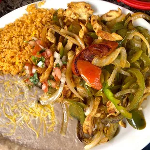Chicken fajitas, tortillas on the side