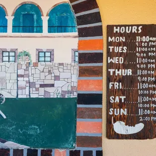 a mural of a horse and carriage