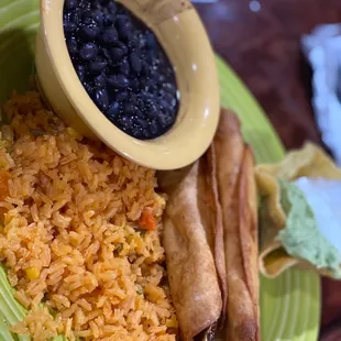 a plate of rice, beans, and sausage