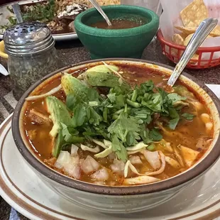 Pozole.. I asked for avocado.. across the way was enchiladas..