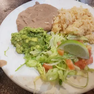 Side of rice, beans, and fresh guacamole for my fajitas