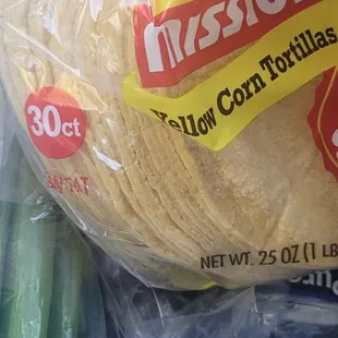 a bag of tortillas and celery
