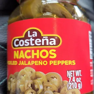 a jar of pickled jalapeno peppers