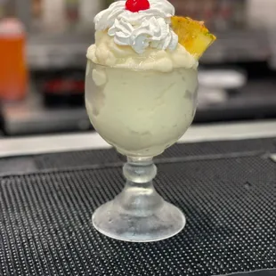 an ice cream sundae with a cherry on top