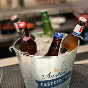 a bucket of beer bottles