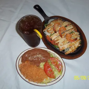 two plates of food and a drink