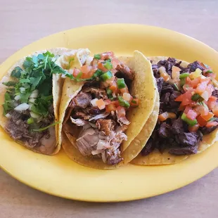 3 regular tacos: barbacoa (left), carnitas (middle), carne asada (right)