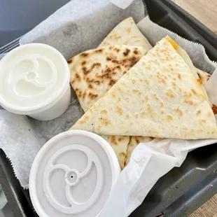 Chicken quesadilla (to go) with side of salsa and sour cream
