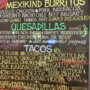 Colorful menu board to peruse as you wait in line to order at the counter. A focused menu of classic Mexican fare.