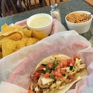 The spread! Single Grilled Seasoned Shrimp Taco, side of rice and queso &amp; chips - $20+ bucks with tip