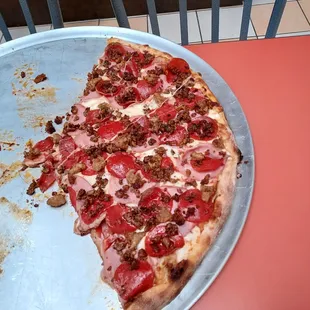 Here is what is left of the XL meat lovers after six boys had their share. Yep, this is a bug, great pizza.