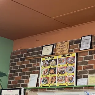 a brick wall with menus on it