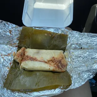 two burritos wrapped in foil