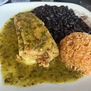 Pork tamale with black beans and rice.