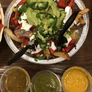 Loaded fries with the mild, hot and habanero salsas-they are so good!