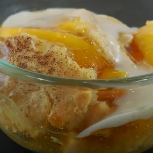 Peach cobbler with Grandma Meyers' recipe cobbler sauce.