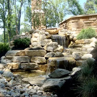a waterfall in a backyard