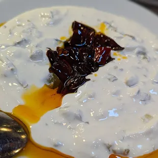 Atom - Homemade strained garlic yogurt with spicy peppers.