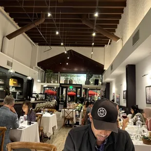 a man sitting at a table in a restaurant