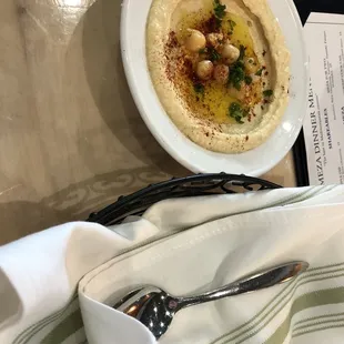 Hummus and pita under the napkins