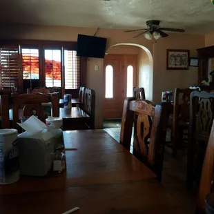 a dining room with a ceiling fan