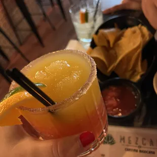 Frozen mango and strawberry margarita