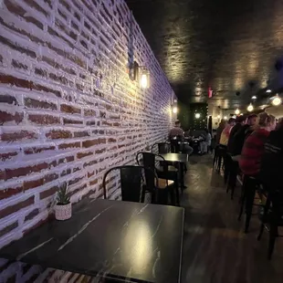 a brick wall and tables
