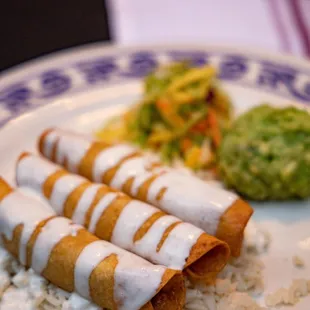 Flautas: Chicken or Potato (we got potato), corn tortillas, broccoli mango slaw, rice, guacamole, and roasted poblano cream.