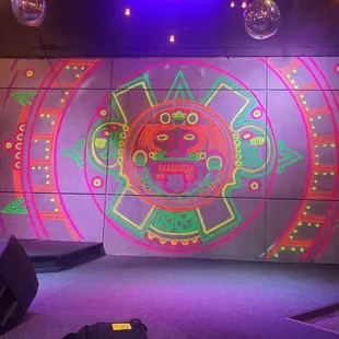 a stage decorated with neon lights