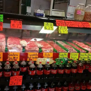 a display of meat and drinks