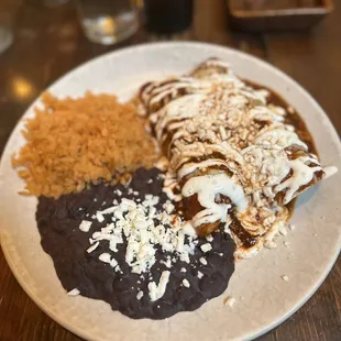Chicken enchiladas with rice and beans
