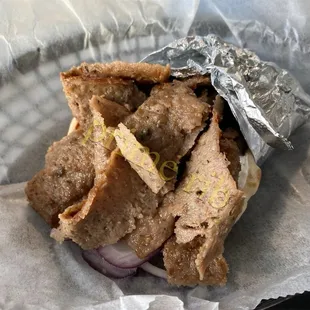 a sandwich wrapped in tin foil
