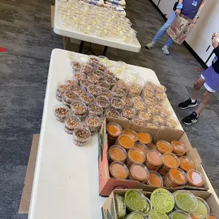 a table of food and people in the background