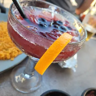 a drink with a garnish