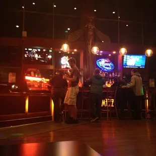 people sitting at a bar