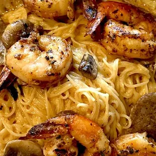 Angel hair pasta in spicy creamy chipotle black pepper sauce with mushrooms and topped with grilled shrimp &amp; sausage.