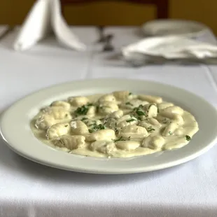 Hand crafted gnocchi with creamy Gorgonzola. Can also be ordered with homemade tomato sauce.