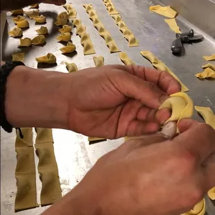 Our handmade tortellini is carefully crafted and filled with a mixture of savory ground pork and veal. They are the star of our Tortellini a
