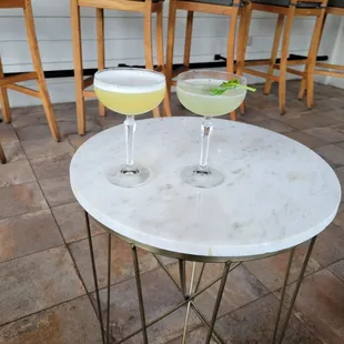 two cocktails on a table
