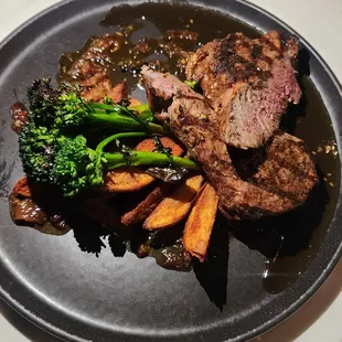 Grilled NY Strip w/bourbon bacon jam, spiced gold potato steak fries, broccolini. $35. The jam is amazing. Love this dish.