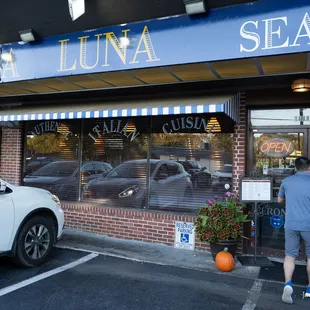 a car parked in front of a restaurant