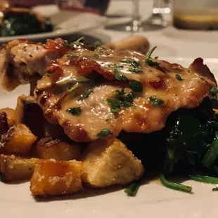 Veal with sautéed spinach and truffle potatoes