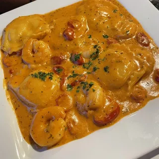 Lobster ravioli with creamy pink sauce and shrimp