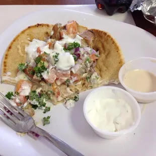 Chicken hummus with a couple of extra sauces on the side... Seriously delicious! We got 2 meals and 2 drinks for about $25.