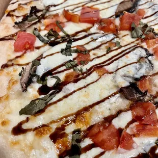 Portabello Mushroom pizza - our new fav! Portabello mushrooms, tomatoes, fresh mozzarella, fresh Basil, and balsamic glaze.