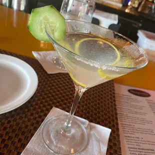 Lemon drop martini with cucumber garnish